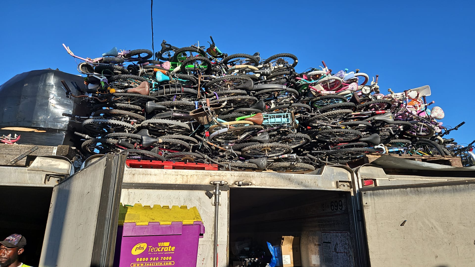 Bicycles stacked on top of a container